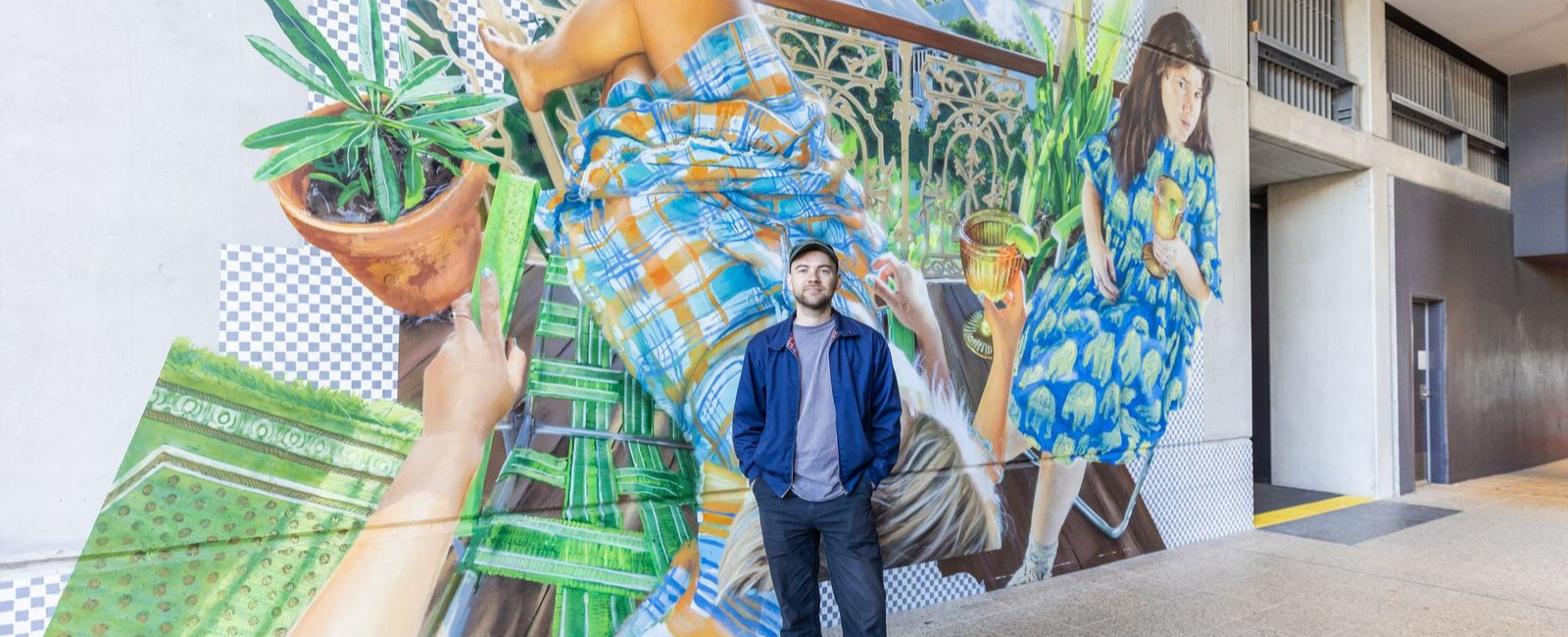 Gus Eagleton infront of artwork