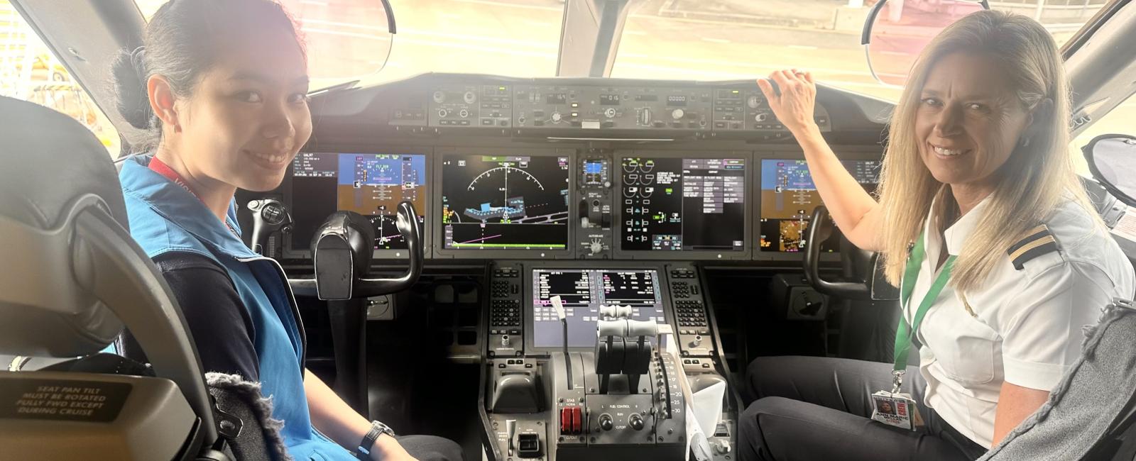 A year 12 student and a pilot in a cockpit