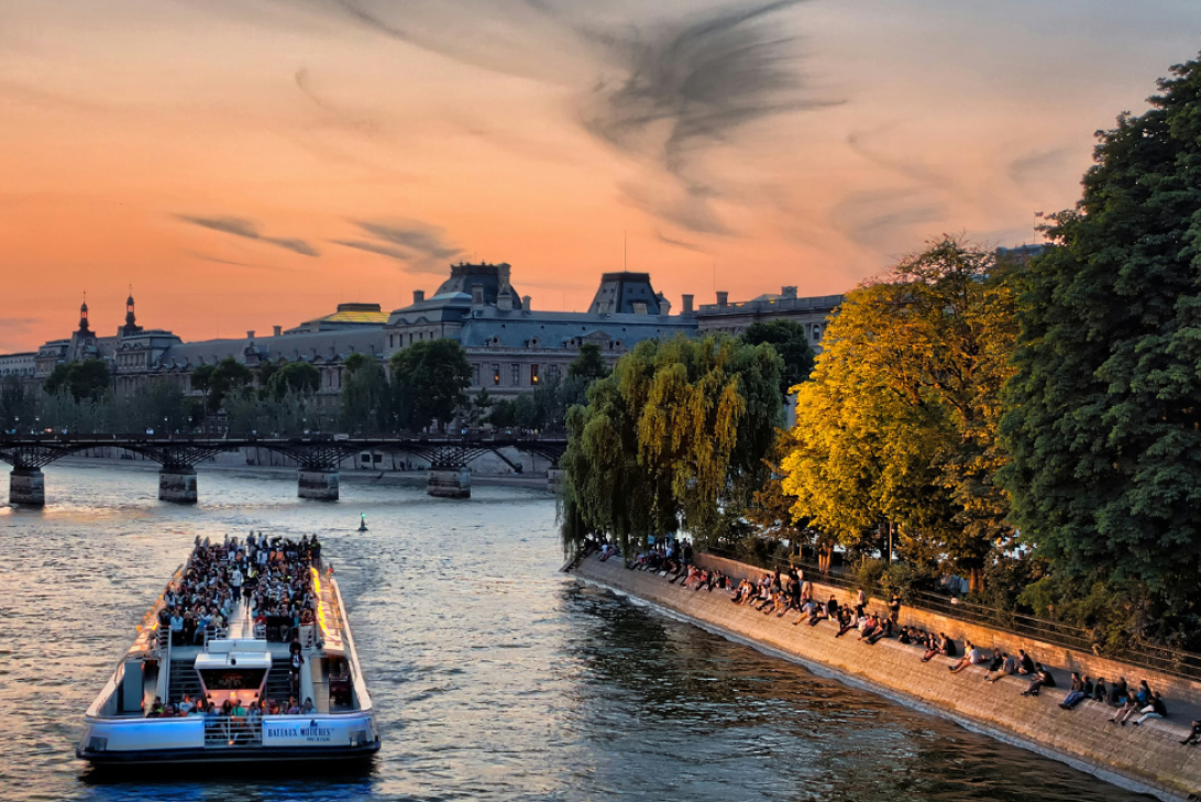 Tour boat along the Seine at sunset